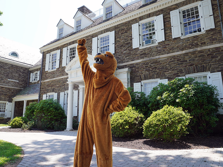 Triumphant mascot in front of Hayfield House